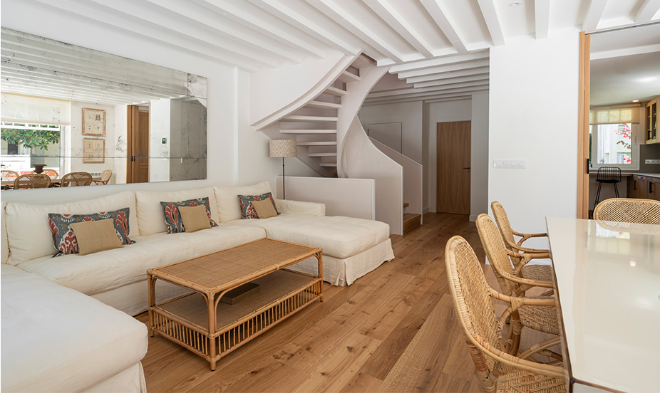 Cozy living area with a warm natural wood floor.